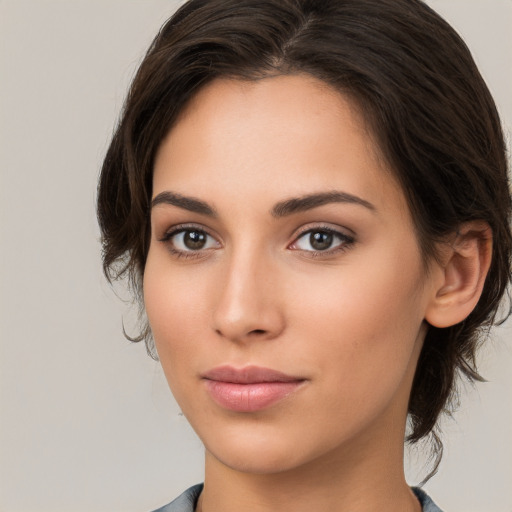 Neutral white young-adult female with medium  brown hair and brown eyes