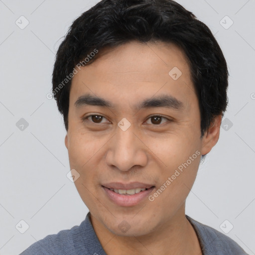 Joyful white young-adult male with short  black hair and brown eyes