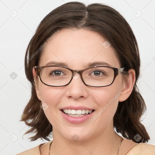 Joyful white young-adult female with medium  brown hair and blue eyes