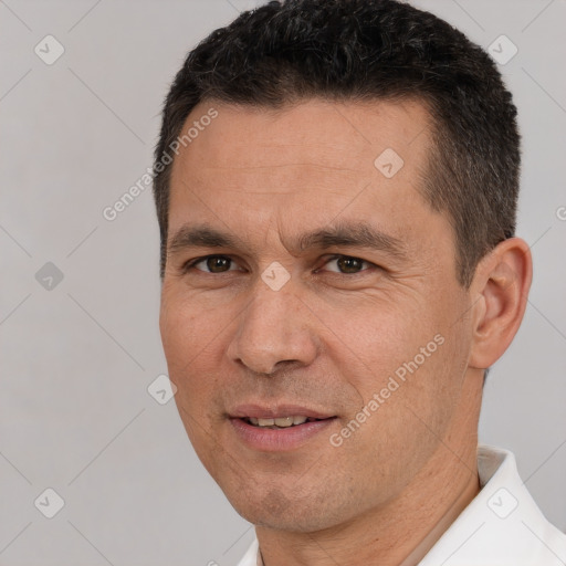 Joyful white adult male with short  brown hair and brown eyes