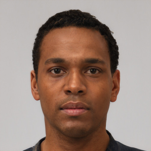 Neutral black young-adult male with short  black hair and brown eyes
