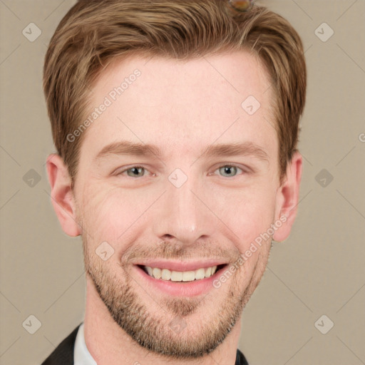 Joyful white young-adult male with short  brown hair and grey eyes