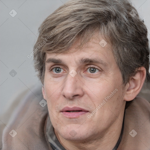 Joyful white adult male with medium  brown hair and brown eyes