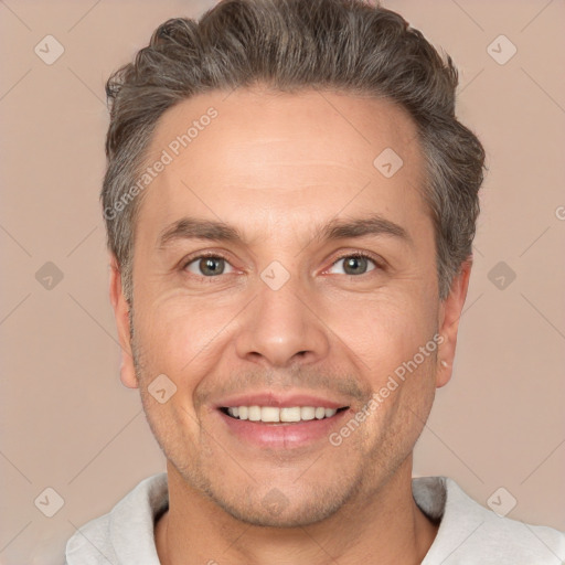 Joyful white adult male with short  brown hair and brown eyes