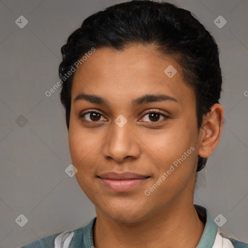 Joyful latino young-adult female with short  black hair and brown eyes