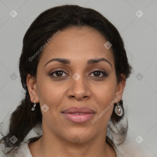 Joyful latino adult female with medium  brown hair and brown eyes