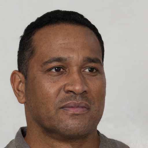 Neutral black adult male with short  brown hair and brown eyes