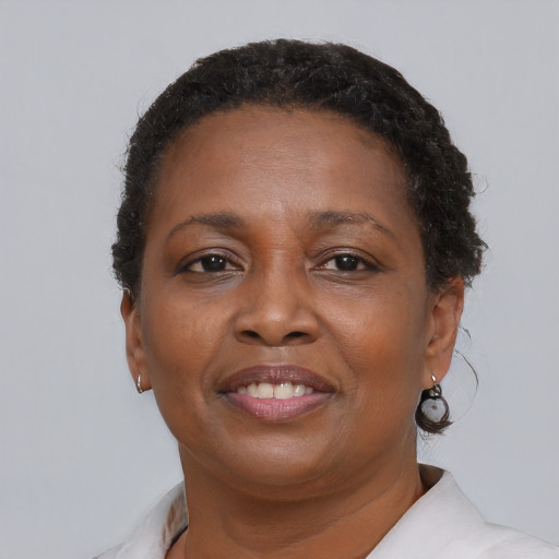 Joyful latino adult female with short  brown hair and brown eyes