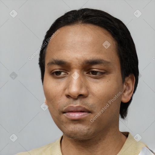 Neutral black young-adult male with short  black hair and brown eyes