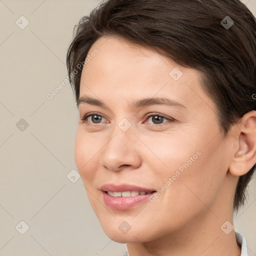 Joyful white young-adult female with medium  brown hair and brown eyes