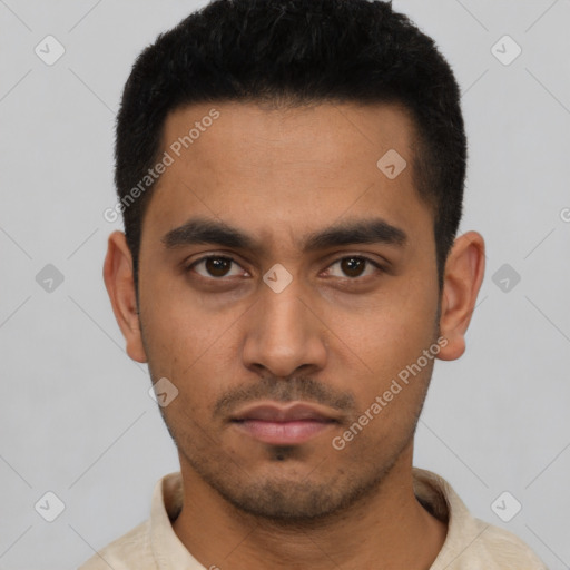 Neutral latino young-adult male with short  black hair and brown eyes