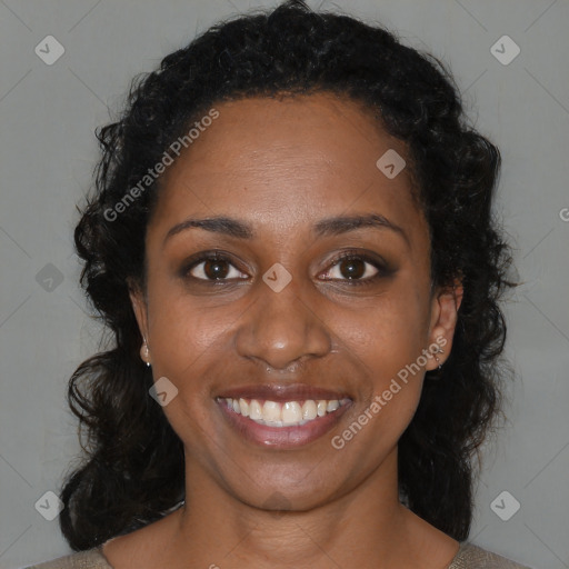 Joyful black young-adult female with medium  brown hair and brown eyes