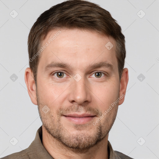 Joyful white adult male with short  brown hair and grey eyes