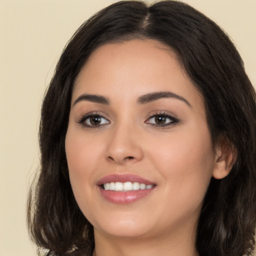 Joyful white young-adult female with long  brown hair and brown eyes