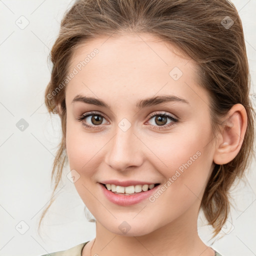 Joyful white young-adult female with medium  brown hair and green eyes