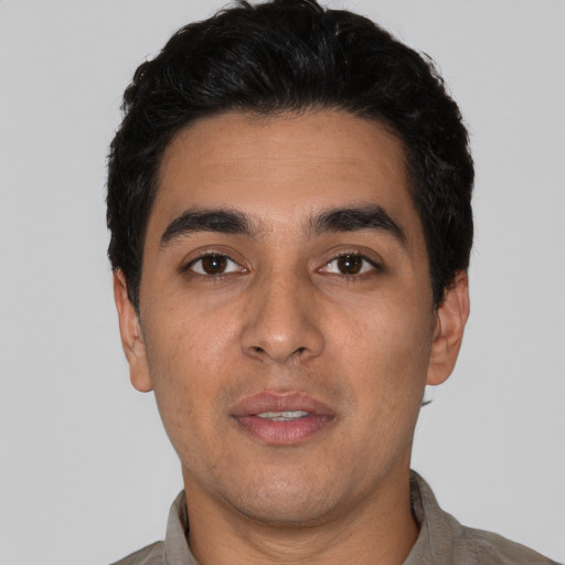 Neutral latino young-adult male with short  black hair and brown eyes