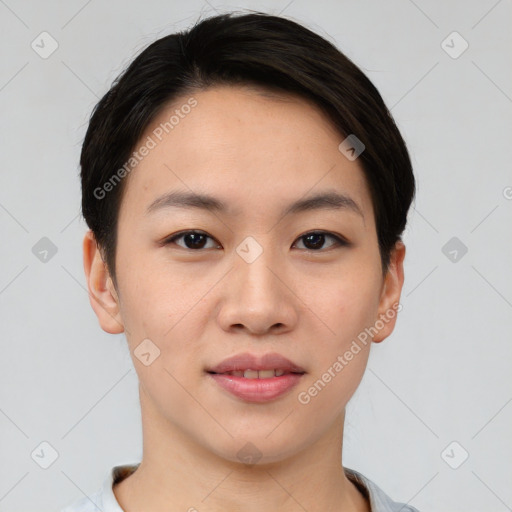 Joyful asian young-adult female with short  brown hair and brown eyes