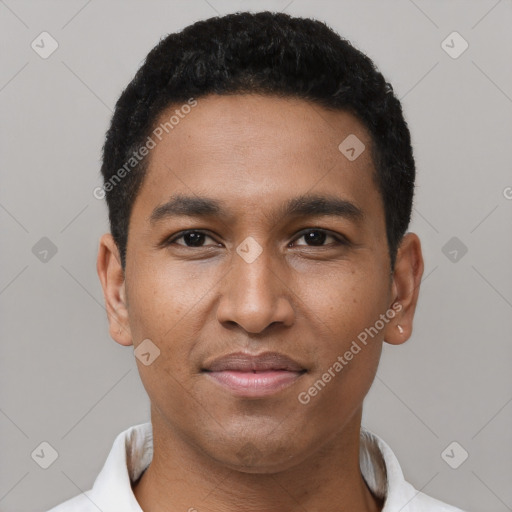 Joyful black young-adult male with short  black hair and brown eyes