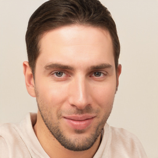 Joyful white young-adult male with short  brown hair and brown eyes