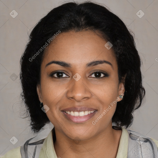 Joyful black young-adult female with medium  brown hair and brown eyes