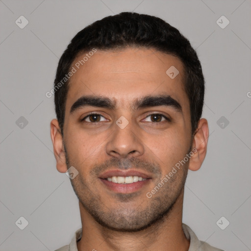 Joyful white young-adult male with short  black hair and brown eyes