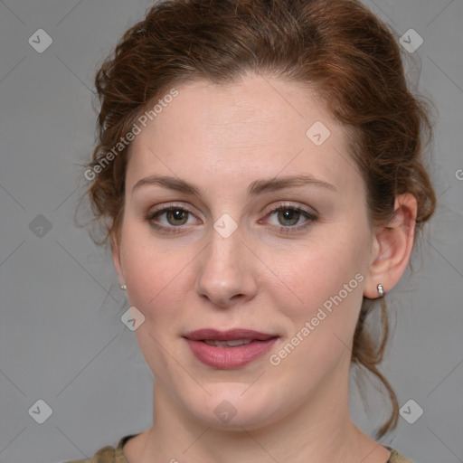 Joyful white young-adult female with medium  brown hair and green eyes