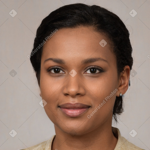 Joyful black young-adult female with medium  black hair and brown eyes