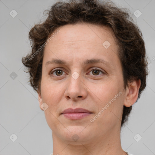 Joyful white adult female with short  brown hair and brown eyes