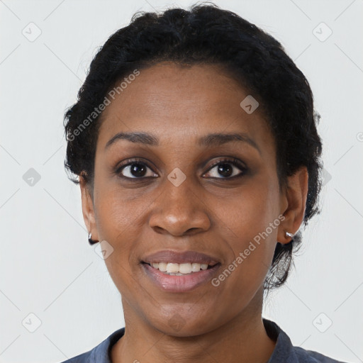 Joyful black young-adult female with short  black hair and brown eyes