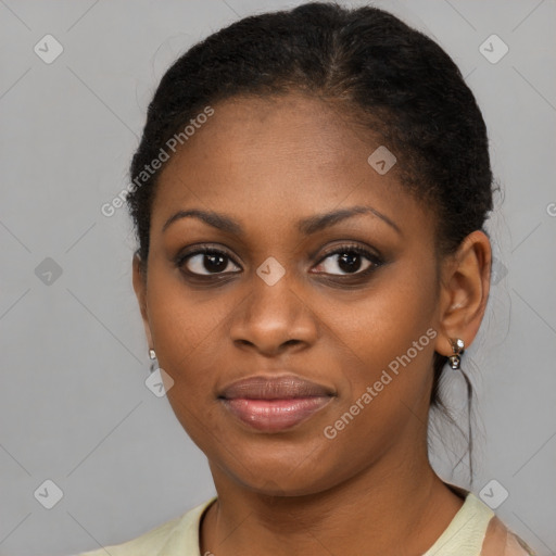 Joyful black young-adult female with short  brown hair and brown eyes