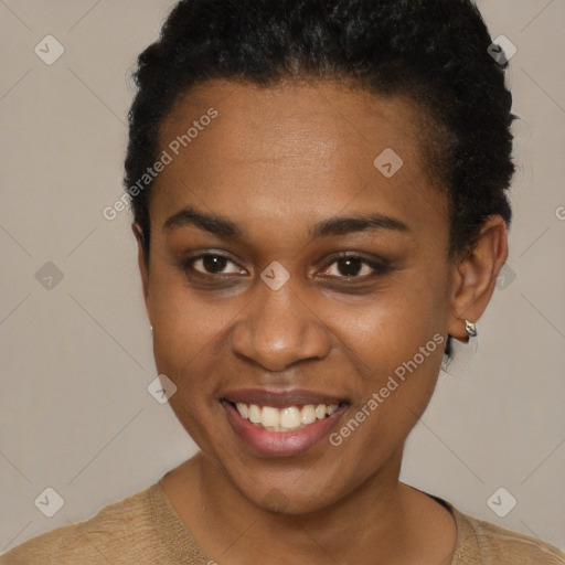 Joyful black young-adult female with short  brown hair and brown eyes