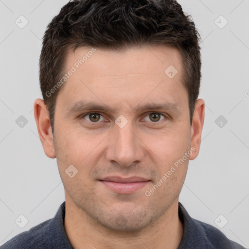 Joyful white young-adult male with short  brown hair and grey eyes