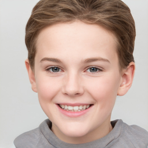 Joyful white child female with short  brown hair and grey eyes