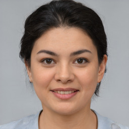 Joyful asian young-adult female with medium  brown hair and brown eyes