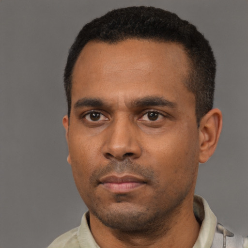 Neutral black young-adult male with short  black hair and brown eyes