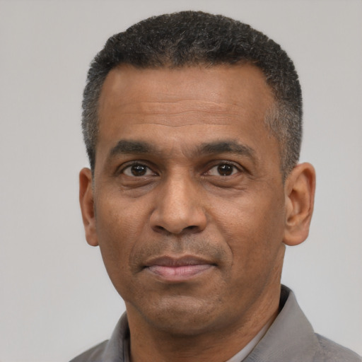 Neutral latino adult male with short  black hair and brown eyes