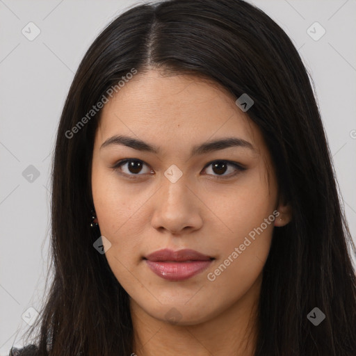 Joyful asian young-adult female with long  brown hair and brown eyes