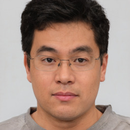 Neutral asian young-adult male with short  brown hair and brown eyes