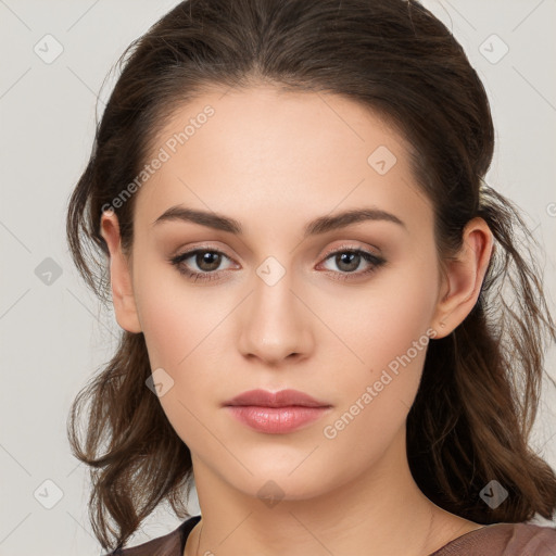 Neutral white young-adult female with long  brown hair and brown eyes