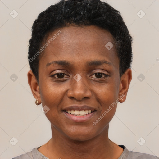 Joyful black young-adult female with short  black hair and brown eyes