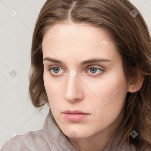 Neutral white young-adult female with long  brown hair and grey eyes