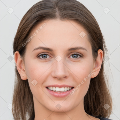 Joyful white young-adult female with long  brown hair and grey eyes