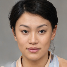 Neutral asian young-adult female with medium  brown hair and brown eyes