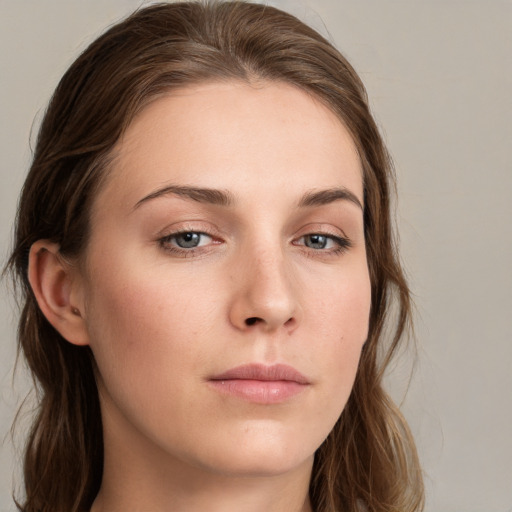 Neutral white young-adult female with long  brown hair and blue eyes