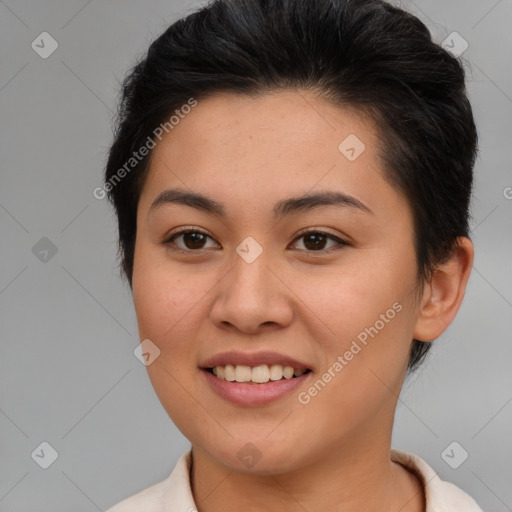 Joyful asian young-adult female with short  brown hair and brown eyes