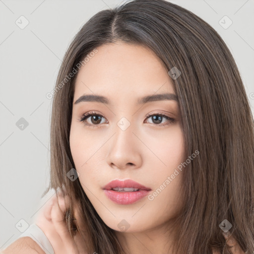 Neutral white young-adult female with long  brown hair and brown eyes