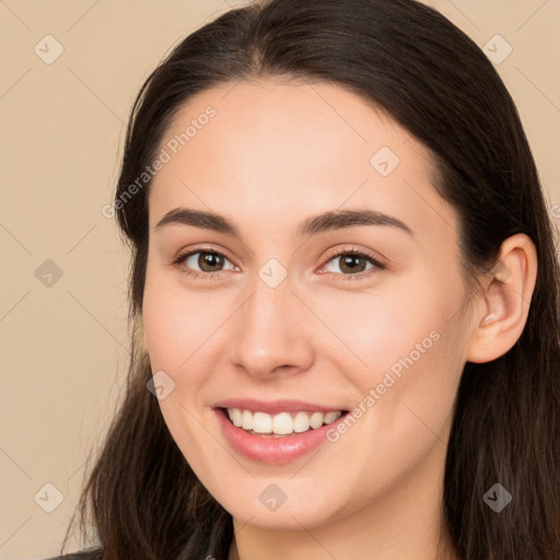 Joyful white young-adult female with long  brown hair and brown eyes