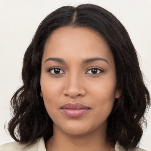 Joyful latino young-adult female with long  black hair and brown eyes