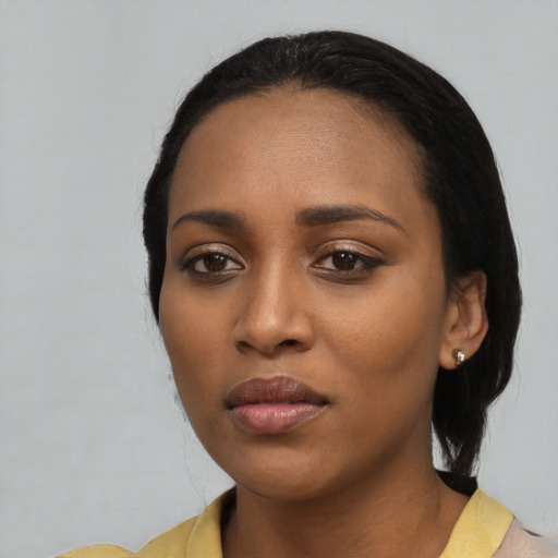 Neutral black young-adult female with long  black hair and brown eyes