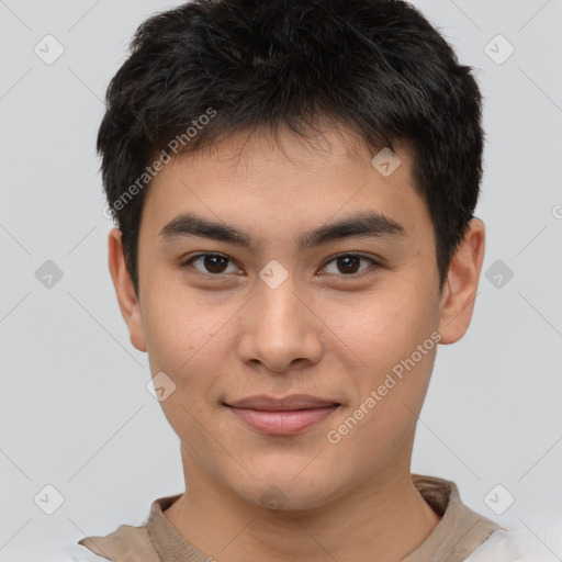 Joyful asian young-adult male with short  brown hair and brown eyes